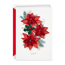 Christmas card with paper poinsettias and ‘Joy’ on the front.