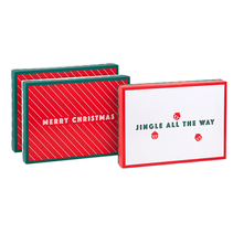 Gift boxes with Merry Christmas' and 'Jingle all the way' on the lids